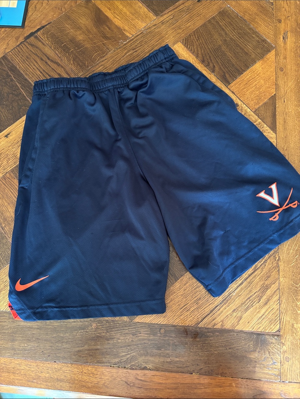 Nike Navy Athletic Shorts with Orange Accents and Logo